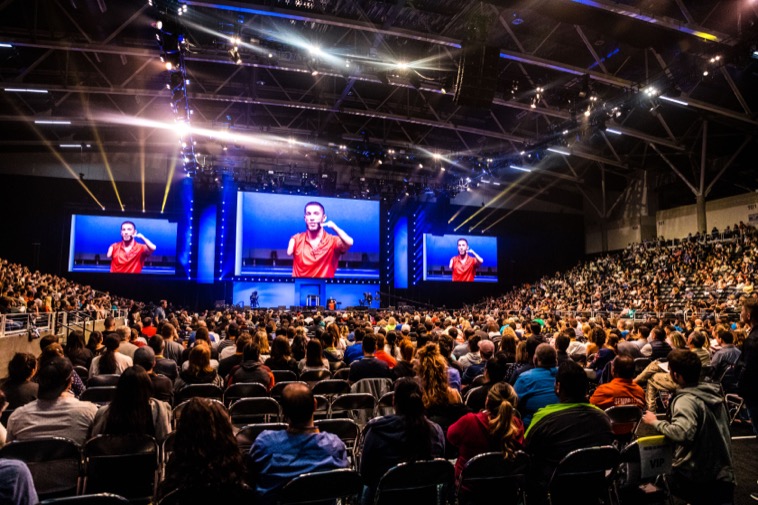 Tony Robbins event audience with Nick Santonastasso on stage
